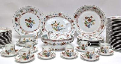 a lot of plates and cups and saucers on the table