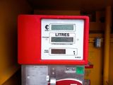 a red and white machine with a sign on it