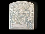 an old silver coin with a picture of a man riding a horse