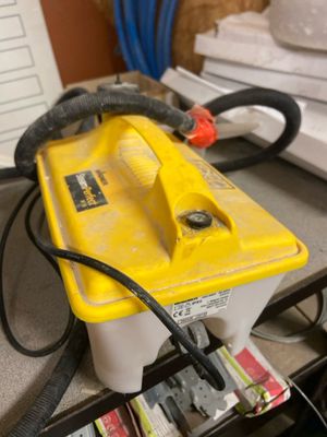 a yellow and black battery sitting on top of a desk