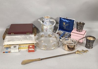 a lot of silver and glass items on a table