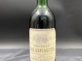 a bottle of wine that is sitting on a table