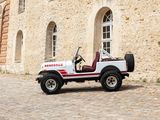 a small white jeep parked in front of a building