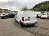 a white van that is parked in a parking lot