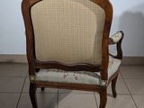 a chair that is sitting on a tile floor