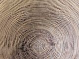 a wicker basket that is sitting on the floor