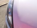 a purple car parked on the side of the road
