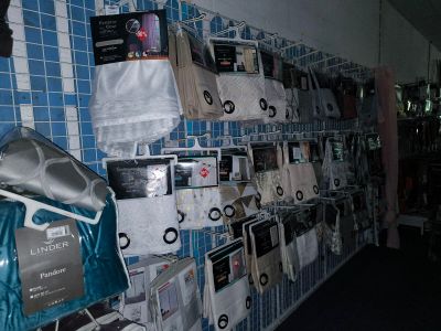 a wall with many items on it in a room