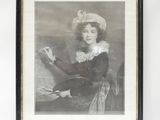 a black and white photo of a woman in a hat holding a paintbrush
