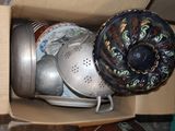 a box full of pots and pans sitting on a table