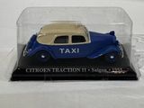 a blue and yellow taxi car in a clear case