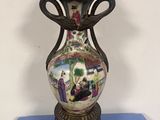 a vase that is sitting on a blue table
