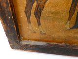 une photo d'un tableau représentant une girafe accroché au mur