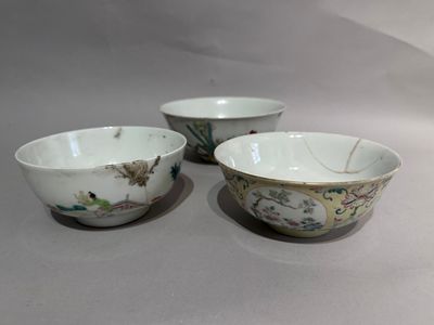 three bowls with designs of birds and flowers on them on a table