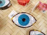 four different types of plastic eye decorations on a table