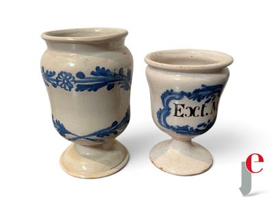 two blue and white vases sitting next to each other