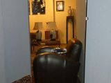 a room with a couch and a chair in it
