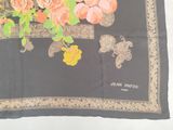 a scarf with a picture of a dog and flowers on it