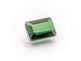 a green tourmaline gems on a white background