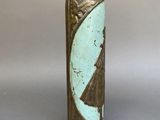 a vase with a blue and green design on it