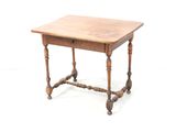 a small wooden table with a drawer on it