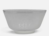 grey glass bowl with a design on the outside of the bowl