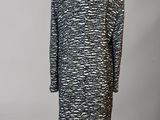 a black and white coat on a mannequin mannequin mannequin mannequin mannequin mannequin mannequin mannequin mann