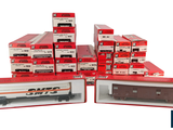 several boxes of red and white train cars stacked on top of each other