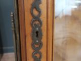 a close up of a door handle on a wooden door