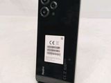 the back of a black phone with a barcode on it