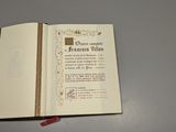 someone is holding a book open to a page with a picture on it