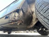 a close up of a car ' s rear end with mud on it