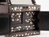 a small wooden box with a mirror in it