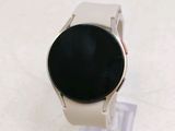 a smart watch that is sitting on a clear stand