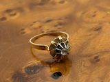 an image of a gold ring with a skull on it
