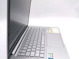 a laptop computer sitting on top of a white table