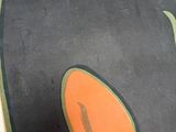 a skateboarder riding down a ramp in a skate park