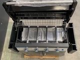 an image of a gas grill with four burners on it