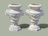 two white vases sitting next to each other on a table