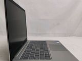 an open laptop computer sitting on top of a white surface