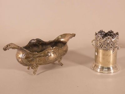 pair of silver plated vases and a silver plated vase on a white surface