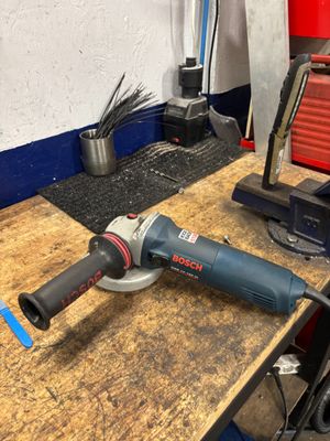 a picture of a sander on a workbench in a workshop