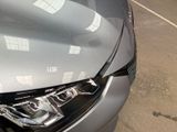 a close up of a car ' s headlight on a parking lot