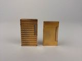 two small wooden blocks sitting next to each other on a white surface