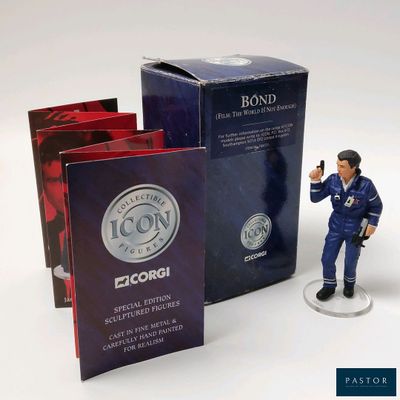 a figurine of a man holding a gun next to a box of books