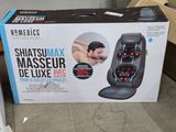 a box that has a massager in it on the floor