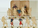 many figurines of soldiers on display in a glass case
