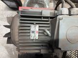 a close up of an electric motor on the ground