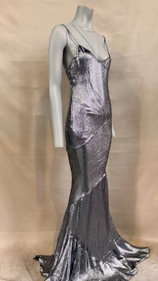 the mannequin is wearing a silver dress on a mannequin mannequin mannequin