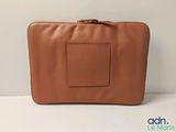 an image of a tan leather case with a brown handle